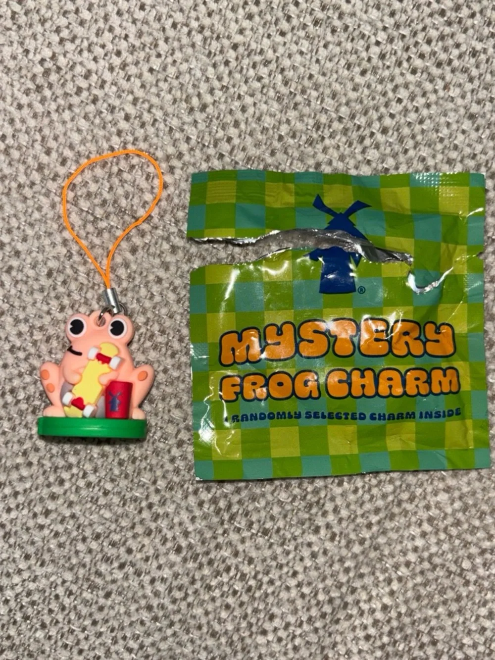 Dutch Bros Pink Frog Charm Phone Strap with Green Base and Orange Cord